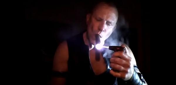  smoking large cigar in leather